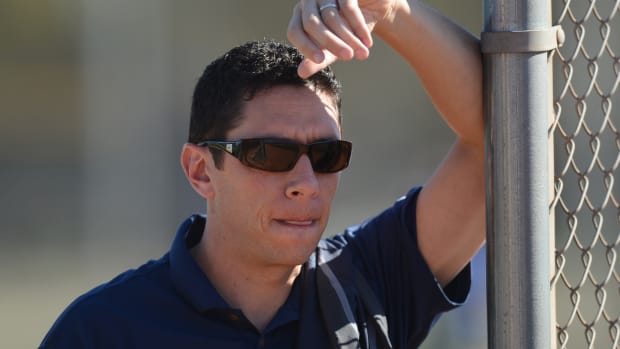Feb 20, 2016; Surprise, AZ, USA; Texas Rangers general manager Jon Daniels looks on during a workout at Surprise Stadium Practice Fields. Mandatory Credit: Joe Camporeale-USA TODAY Sports